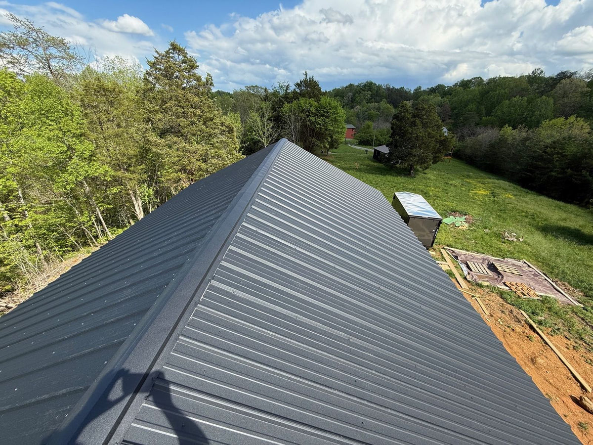 Standing-seam metal roof on a small cabin